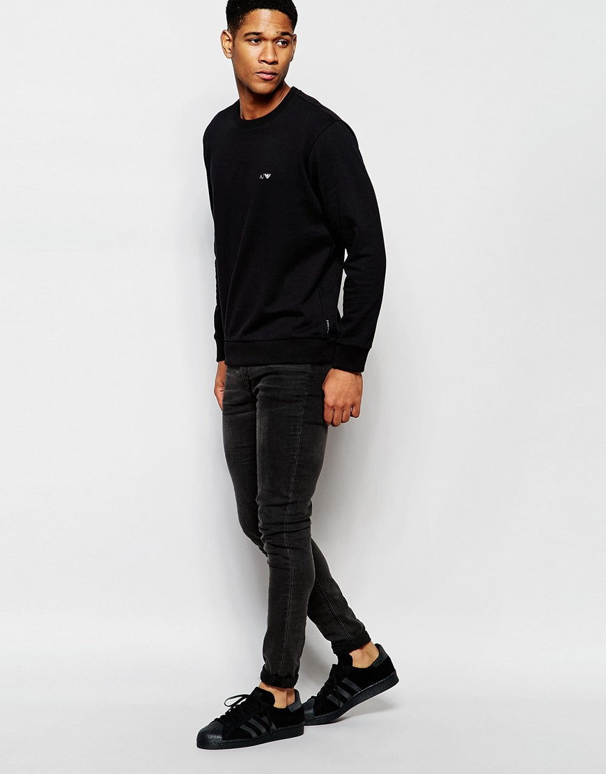 Dark black jeans with a grey sweatshirt or full sleeve t shirt